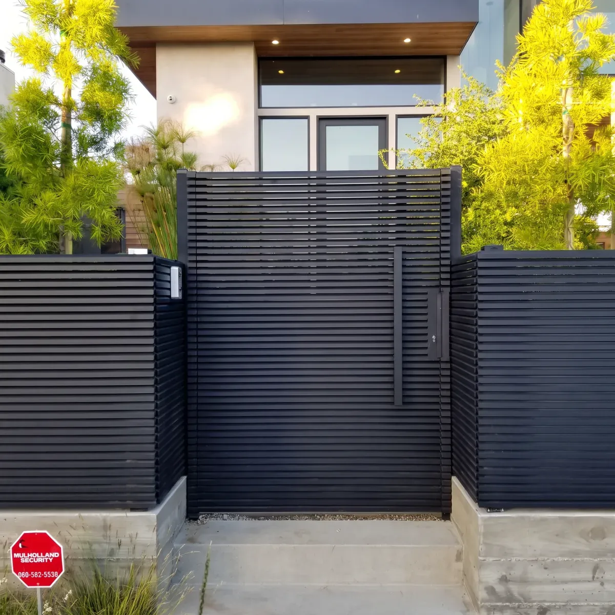 The same aluminum gate after weathering — the finish, the colour and the alignment unchanged.