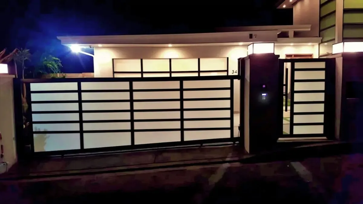 Black aluminum and glass driveway gate