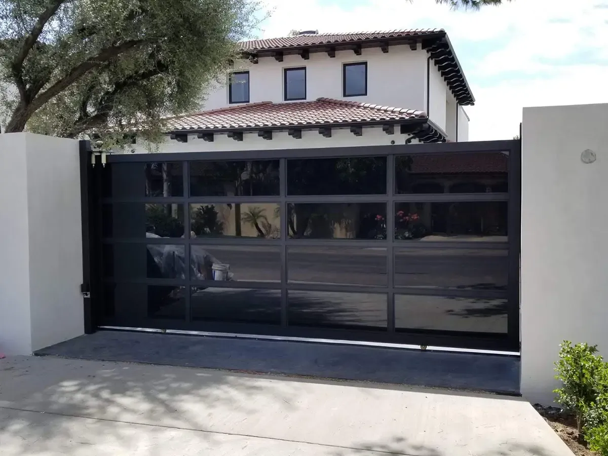 Black aluminum and glass driveway gate