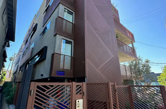 Aluminum cladding and balcony screens on an apartment building