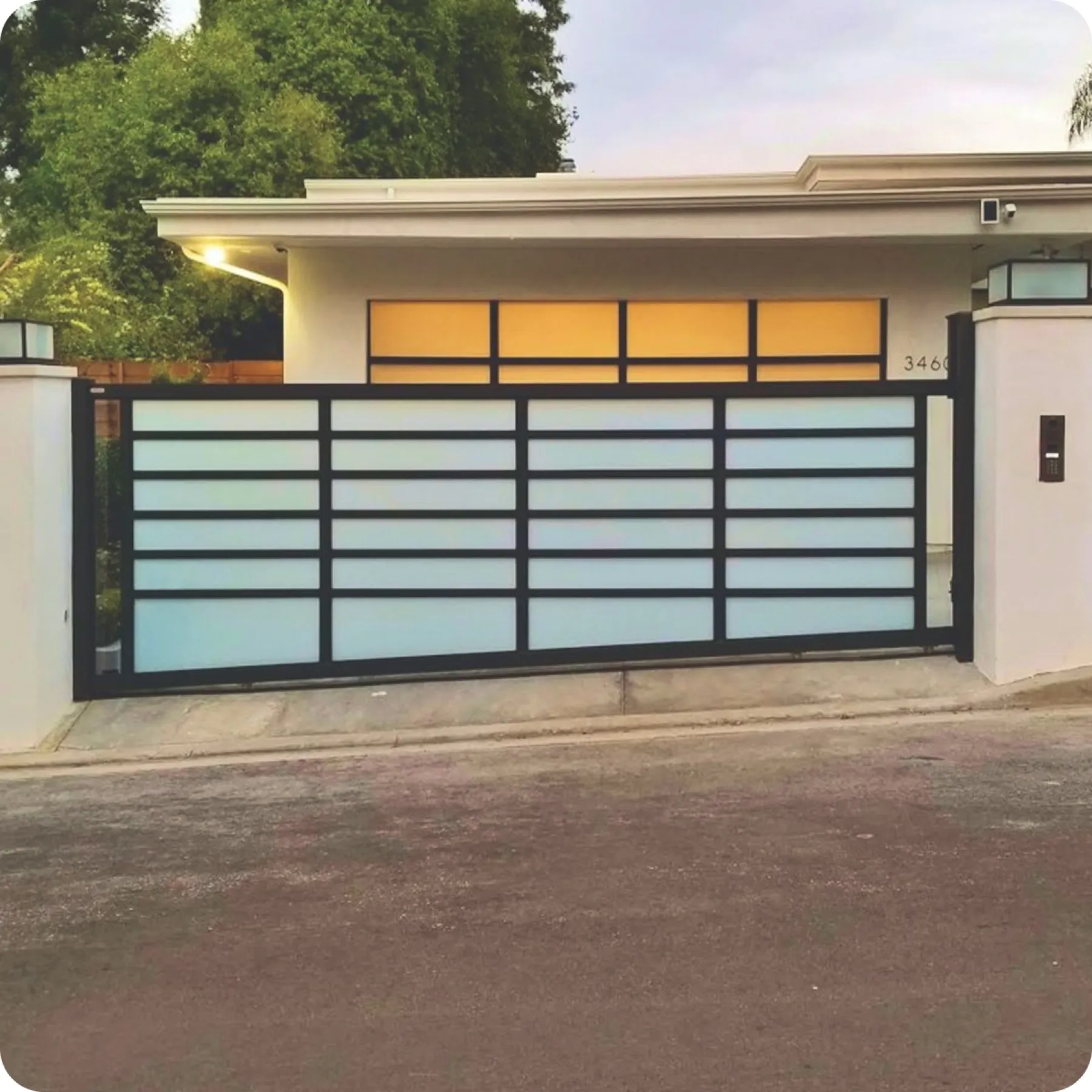 Black Driveway Gate with White Glass, installed by Mulholland Brand