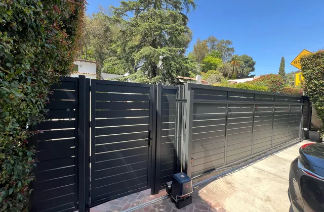 Dark horizontal-slat aluminum driveway gate, open