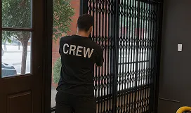 A Mulholland crew member fitting a retractable security gate on site