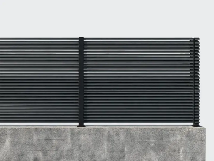 Aluminum topper panels mounted along the top of a garden wall.