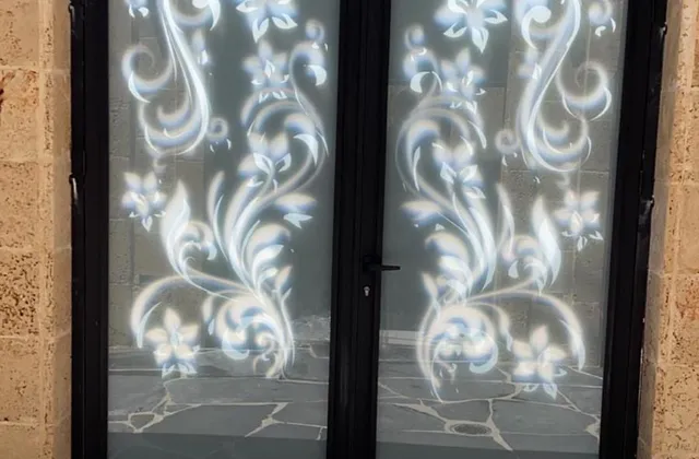 Laser-cut aluminum doors with a floral pattern