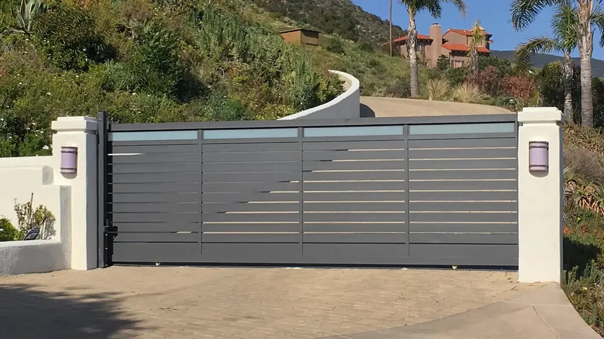 Aluminum and glass driveway gate
