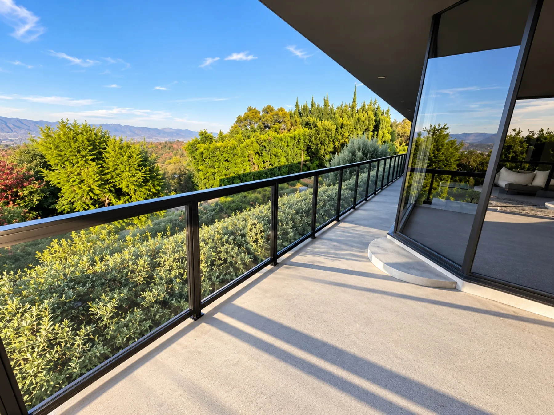Black-framed glass railing installed by Mulholland Brand