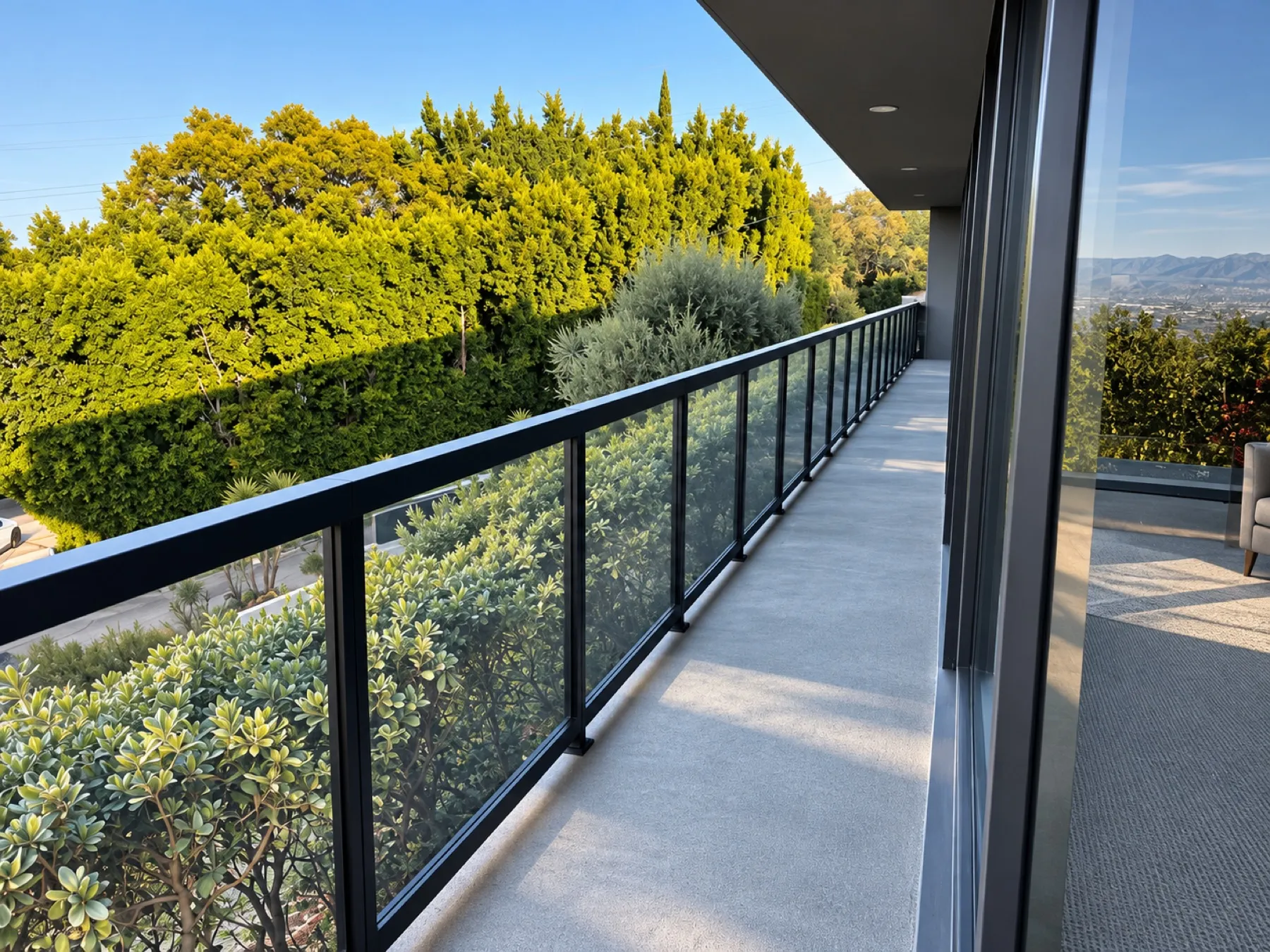 Black-framed glass railing installed by Mulholland Brand