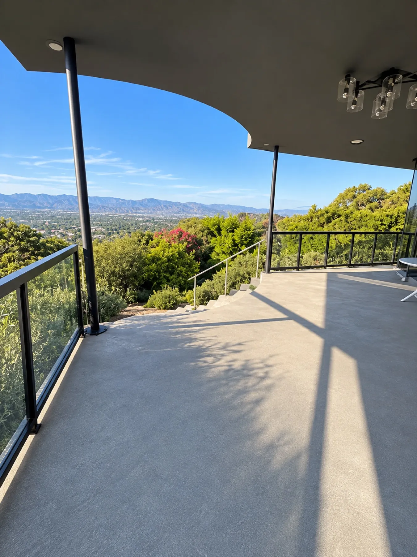 Black-framed glass railing installed by Mulholland Brand