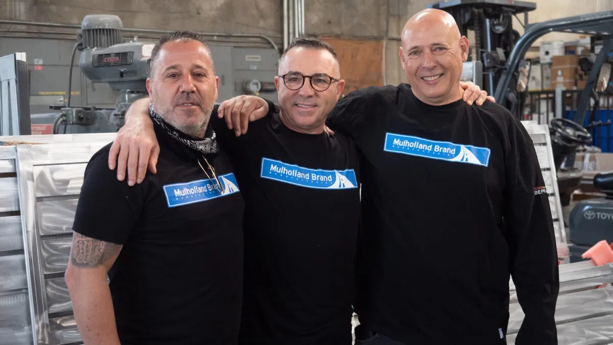 Team members in a Mulholland Brand fabrication bay