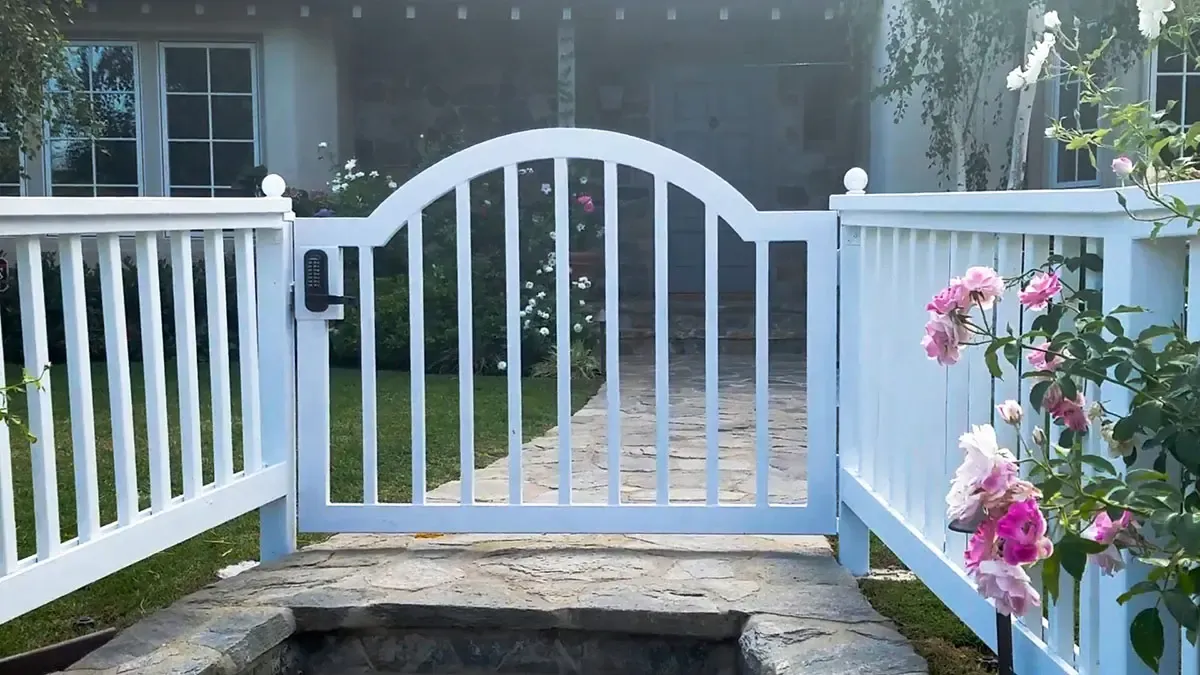 White wood entry gate with fencing