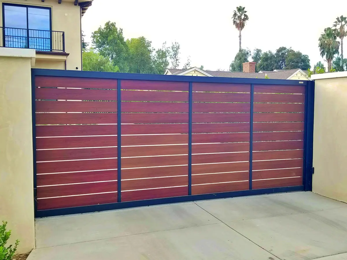 Woodlike aluminum driveway gate