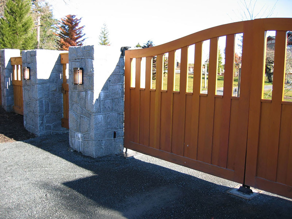 Tan wood driveway gate and fence