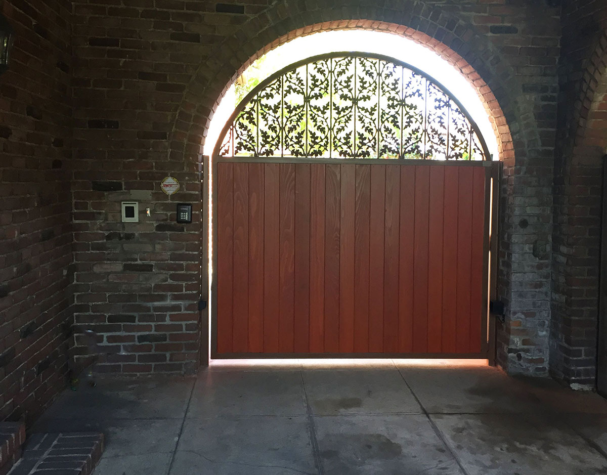 Wood entry gate with decorative iron