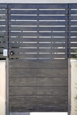 Horizontal slated wood entry gate