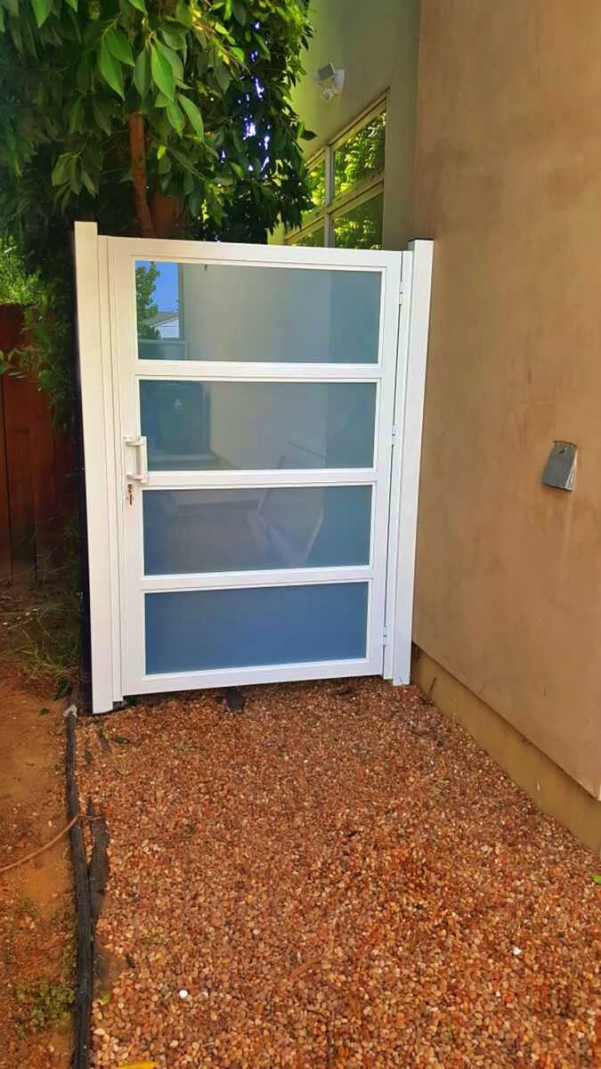 White aluminum and glass side entry gate