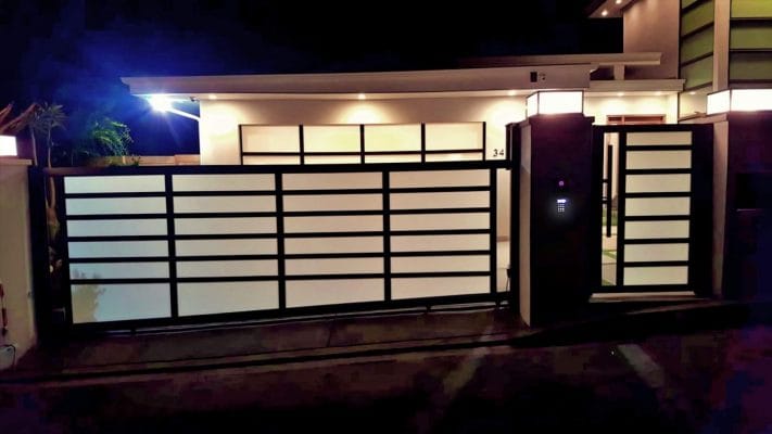 Black aluminum and glass driveway gate