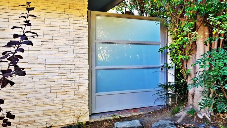 Gray aluminum and glass side entry gate