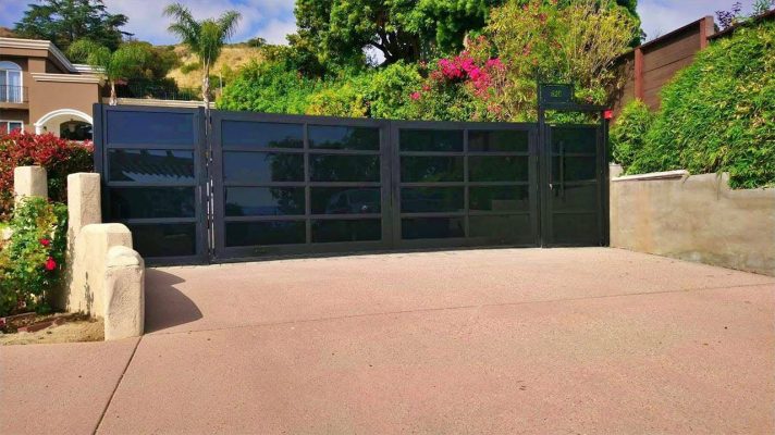 Black aluminum and glass driveway gate