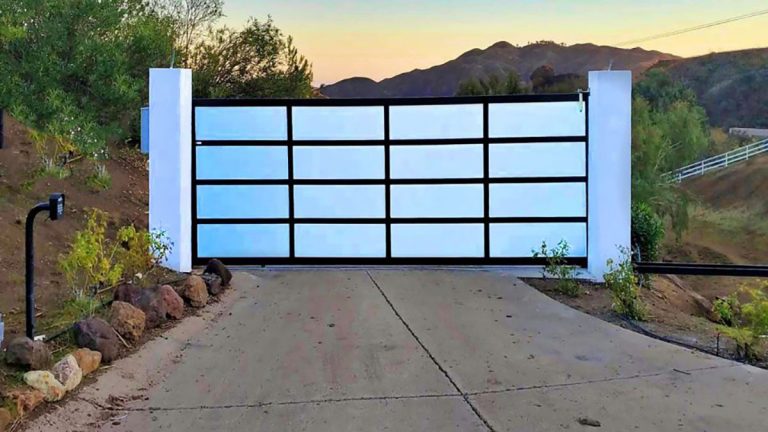 Black aluminum and glass driveway gate