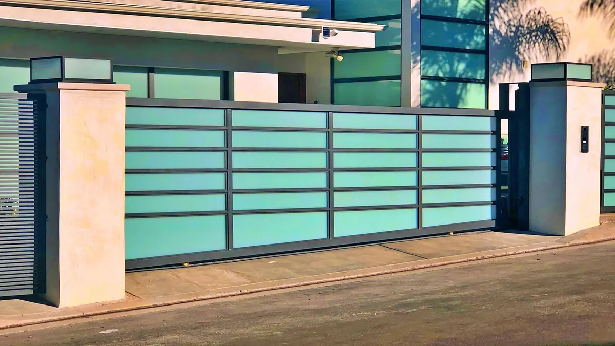 Black aluminum and glass driveway gate