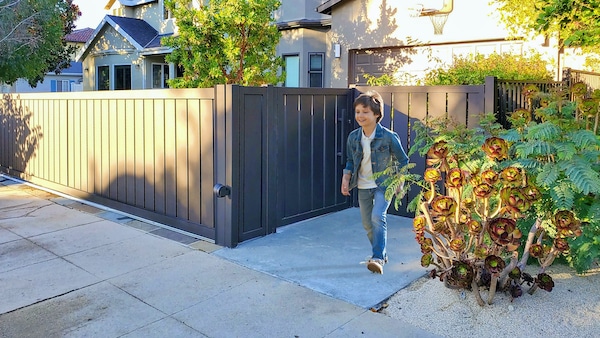 Child running in front of Mulholland Brand gate