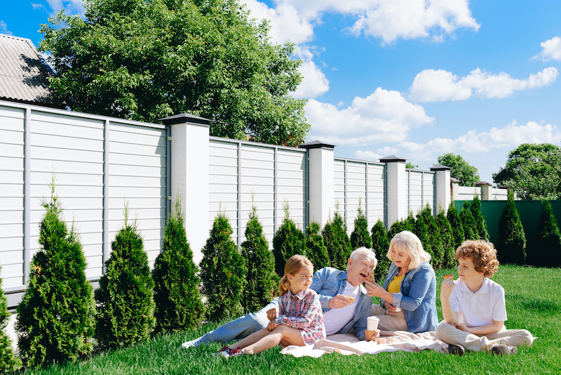 Family enjoying backyard privacy fence