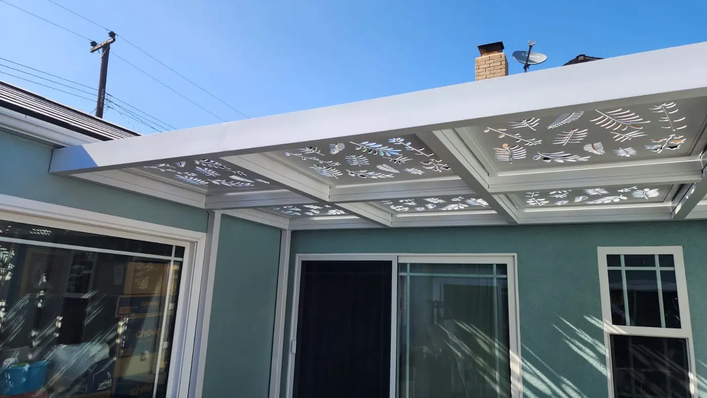 Decorative white attached patio cover